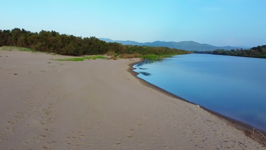 Aerial View of river, Beautiful Aerial View of African Jungles forest and River, Landscape in aerial drone shot. Adove calm tranquil river in Jijel Algeria North Africa, Rivers and green fores trees. river, forest, aerial, water, nature, view, tree, lake, algeria, africa, african, landscape, environment, stream, travel, jungles, background, natural, flow, outdoor, african jungles, mountain, green, beautiful, above, wild, hill, valley, scenic, top, tropical, park, canyon, flowing, plant, simple, blue, sea, sky, wave, grass, wet, waterfall, trees, reflection, clouds, jijel, spring, summer.