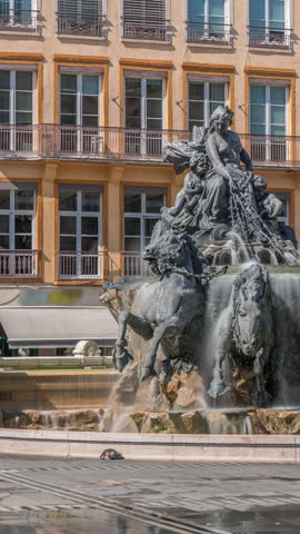 Hyperlapse of the Bartholdi Fountain, a symbol of Lyon, located on Place des Terreaux near City Hall. Equestrian sculpture with flowing water, surrounded by historic architecture timelapse. France
