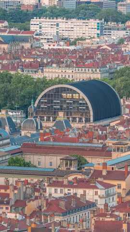 Aerial timelapse of Hotel de Ville de Lyon, the historic city hall of Lyon, France. Historic center with red roofs from above. A baroque and classical architectural marvel under a blue sky
