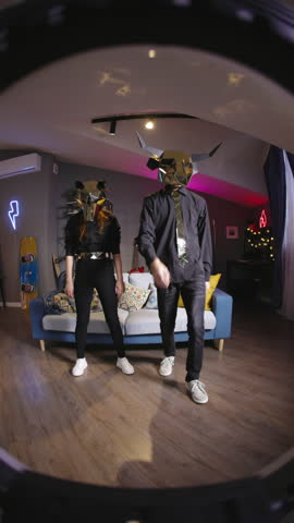 Gen Z creators gold mask dance challenge fan cam UGC trend sync performance fox bull mascot duo home studio vertical video for reels tiktok social content