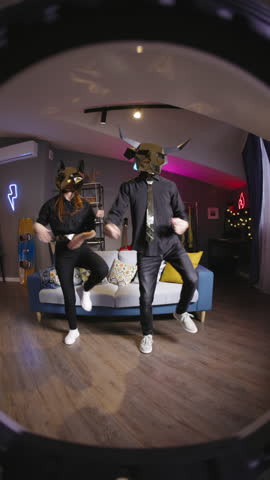 Gen Z creators gold mask dance challenge fan cam UGC trend sync performance fox bull mascot duo home studio vertical video for reels tiktok social content