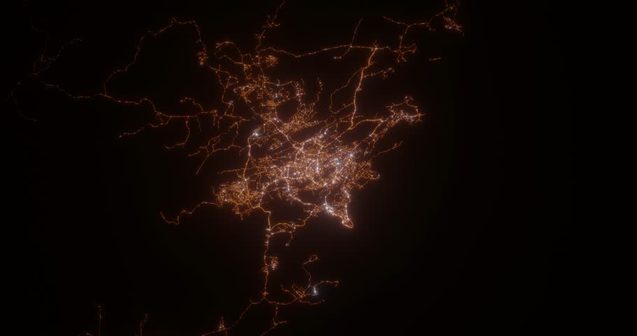 Port Moresby (Papua New Guinea) top view at night. Top view on modern city with street lights and glow effect. Camera is zooming in, rotating clockwise. Vertical video. The north is on the left side