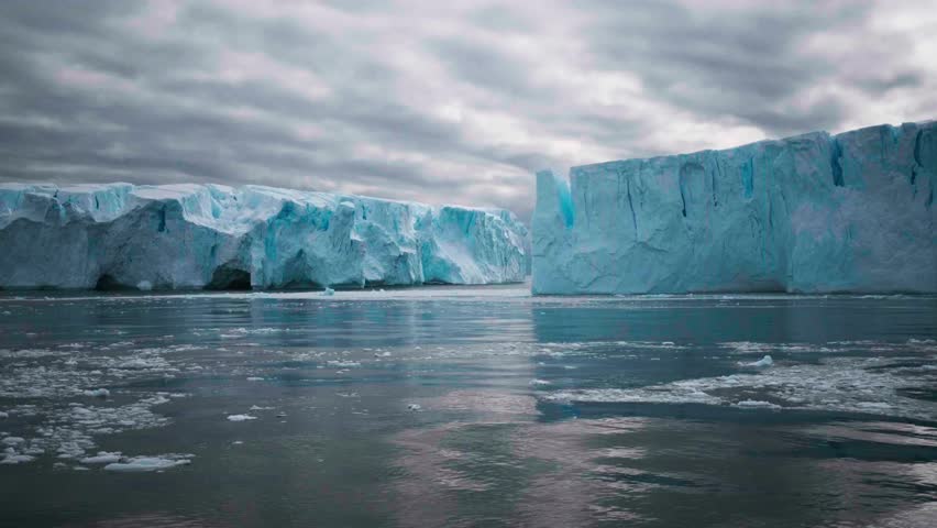Big Iceberg in Antarctica Winter Scenery, Amazing Shape Ice Formation of Massive Large Enormous Blue Icebergs in Antarctic Peninsula Landscape Seascape with Ocean Sea Water