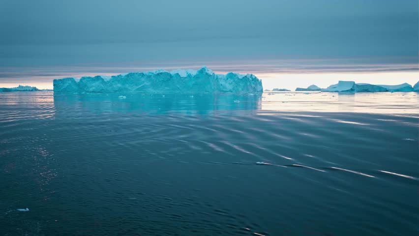 Big Iceberg in Antarctica Winter Scenery, Amazing Shape Ice Formation of Massive Large Enormous Blue Icebergs in Antarctic Peninsula Landscape Seascape with Ocean Sea Water