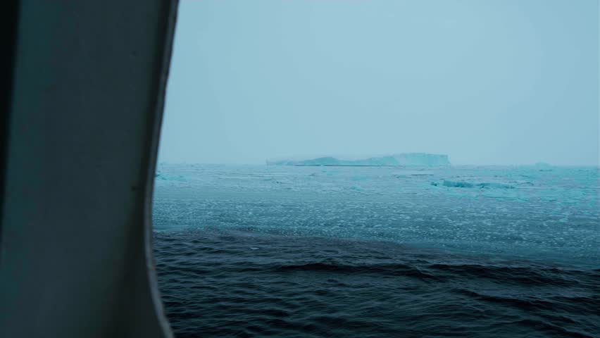 Melting Iceberg Pieces in ocean, sea or lake. Huge Piece of Glacier. Glaciers are melting at north circle of the world. Arctic glacier. Beutiful reflection on water. Static camera