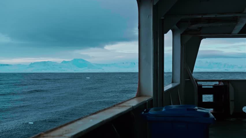 Antarctica. Boat sailing among icebergs