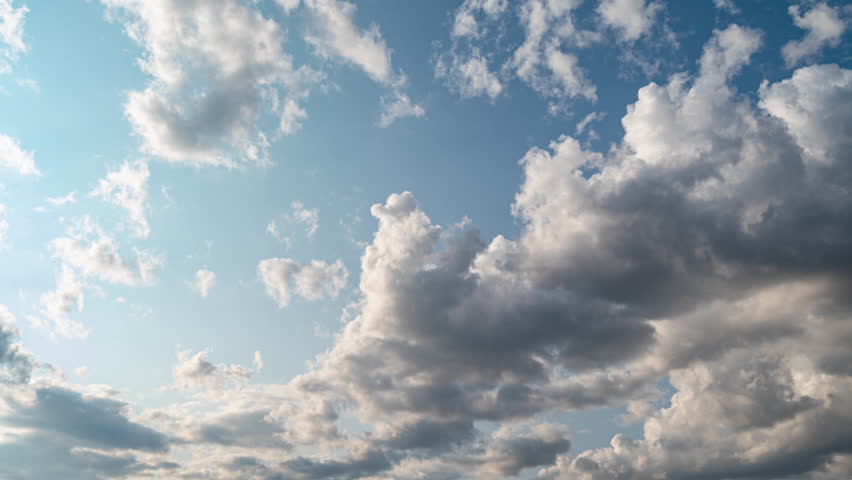 Blue Sky with White Clouds and Sun. Puffy Fluffy White Clouds Moving Fast. Cumulus Cloudscape Timelapse. Summer Nature Weather Sky Time Lapse Video
