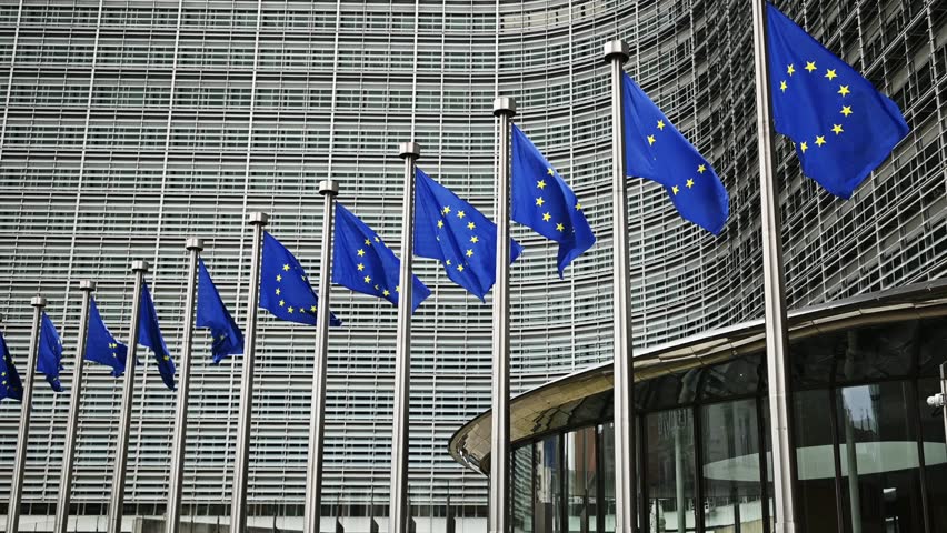 European Union Flags Waving In Brussels Opposite The European Commission Building