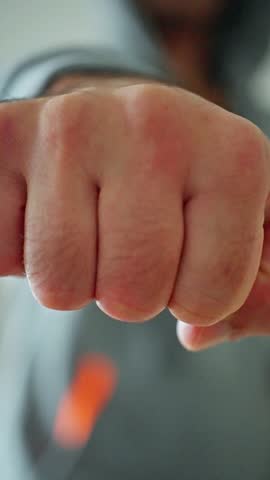 Man Raising His Fist Ahead, Man With Fist Extended Forward, Focused Depiction Of Man With His Fist Raised High, An Image Portraying Man Actively Extending His Fist Outward In Determination