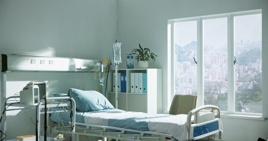 Empty bed, hospital and room for healthcare, wellness and recovery in icu with medical equipment. Clinic, interior and facility with iv drip, ECG monitor and tools for healing with rehabilitation