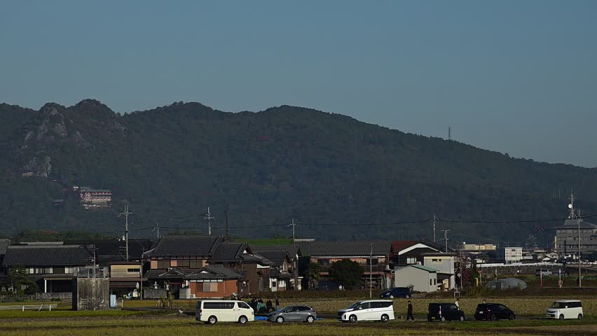 A hot air balloon flying with Tarobogu Shrine in the background (Higashi-Omi, Shiga, 2025, Nov.)