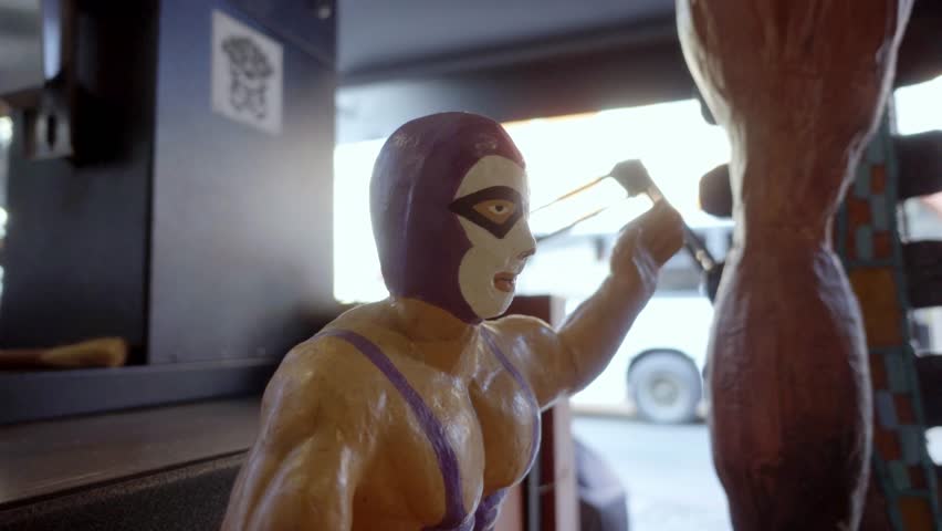 Lucha libre mexican wrestler figurine posing with pride