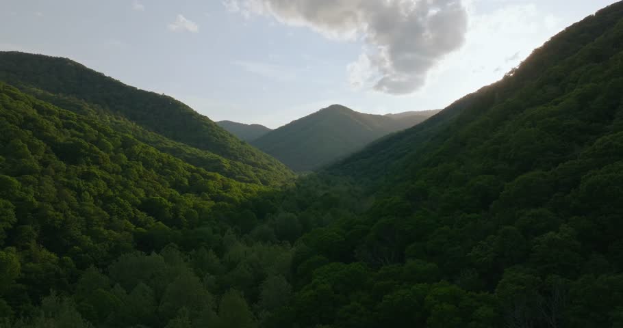 Scenic view of lush green Appalachian mountains in West Virginia at sunset
