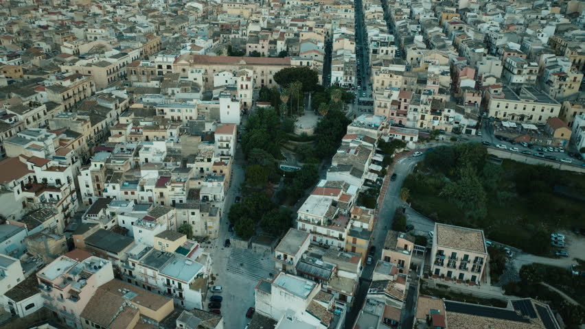 Cinematic aerial over Via Don Luigi Sturzo Castellammare del Golfo after sunset