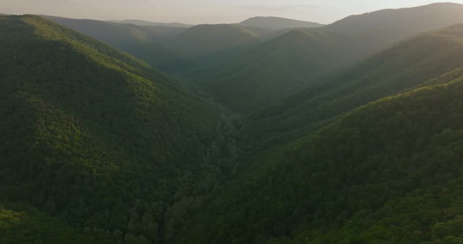Serene aerial view of lush green mountains in West Virginia, USA