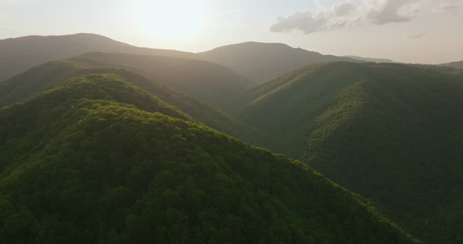 Sunrise over lush West Virginia mountains conveying serenity