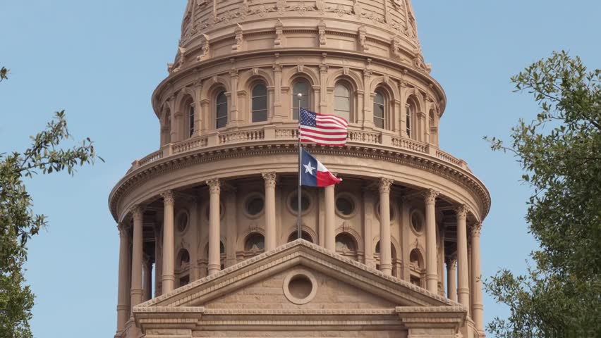 Close-up exterior daytime view of the Texas State Capitol dome in downtown Austin, Texas, with architectural details, day night matching available.
