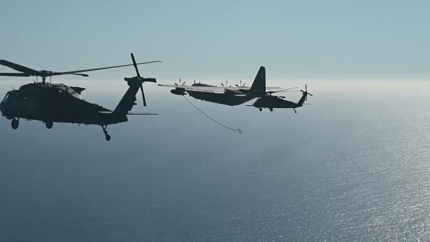 Joint flight formation over the sea area, involving a large transport aircraft and two military helicopters.