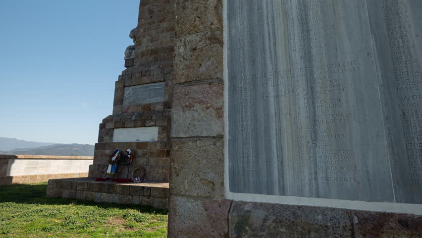 Doiran Memorial timelapse showing engraved names of fallen soldiers in foreground and the main wreath monument with wreath laying at the memorial at Northern Greece