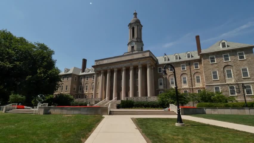 State College, Pennsylvania circa August 2015 establishing shot of Old Main building on the Penn State University campus, iconic academic landmark.