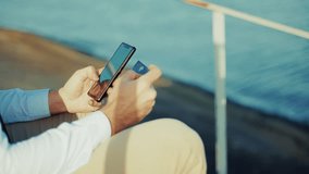 Using Smartphone And Holding Credit Card For Online Shopping. Businessman Making Digital Payment Bank Transaction. E-commerce And Fintech. Secure Mobile Banking Technology. Entrepreneur Buying Service - Powered by Shutterstock - Get 15% off with code: PIKWIZARD15