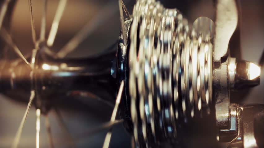 Bicycle Cassette And Chain Mechanism On Rear Wheel. Metal Gears And Spokes. Bike Transmission Parts And Maintenance. Professional Cycling Equipment.Modern Drivetrain System. Road Bike Hardware Cycling