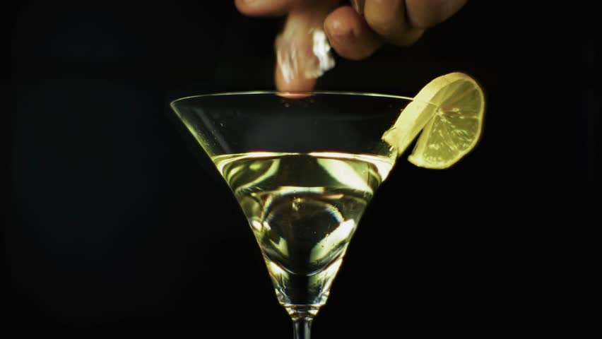 Refreshing Martini Cocktail With Ice Cubes And Lemon Slice. Elegant Glassware With Transparent Alcohol Drink, Bar Menu Presentation. Luxury Beverage, Party And Celebration. Alcohol Appetizer Martini