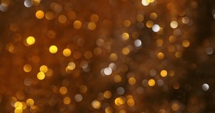Slow motion macro shot of luminous gold and silver bokeh lights floating playfully in abstract motion, forming a bright, celebratory atmosphere with rich texture and shimmer at 1000 fps. - Powered by Shutterstock - Get 15% off with code: PIKWIZARD15