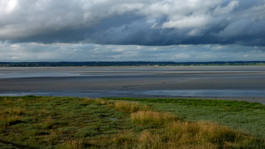 Mont Saint-Michel bay at sunset. Panning 4K