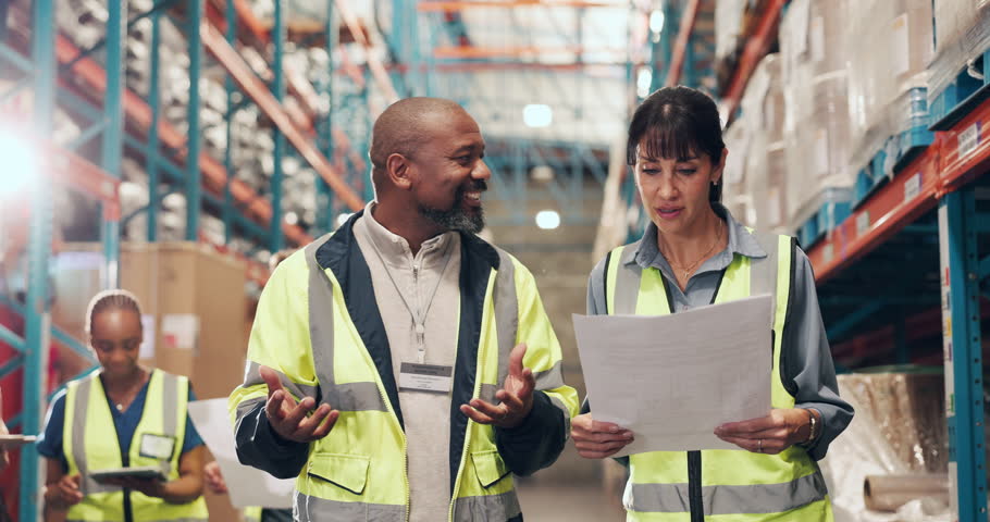 Logistics, warehouse discussion or people with paperwork, stock storage plan or package organization. Freight inspection, distribution streamline idea or staff walk in depot, cargo schematic or talk