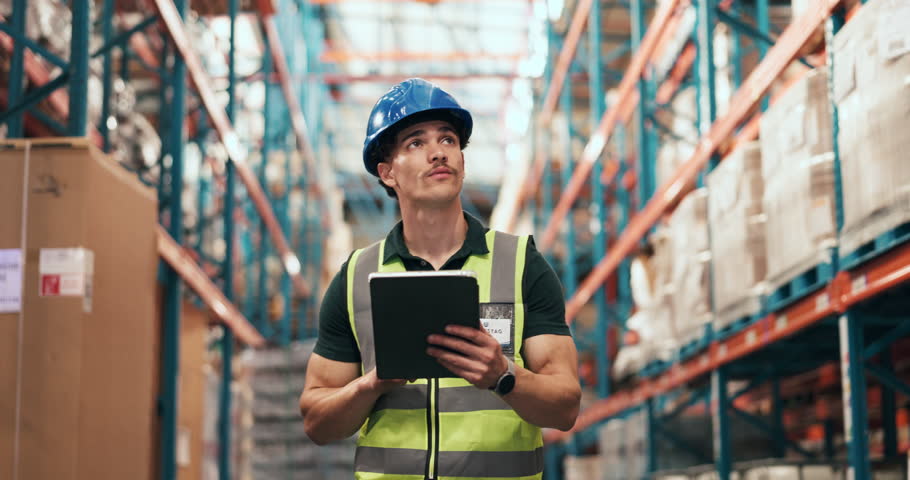 Walking, tablet and man in warehouse for shipping management, stock inspection or distribution. Logistics, supply chain worker or person with tech for storage, inventory or quality control with flare