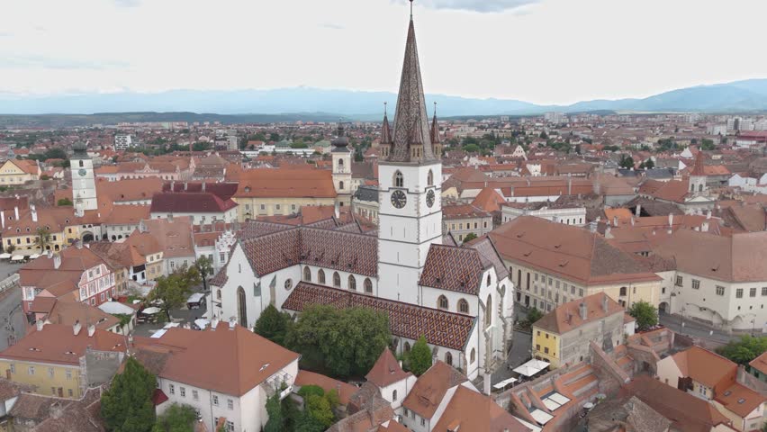 Aerial shot orbiting Saint Mary’s Lutheran Cathedral, highlighting historic features and surrounding cityscape.