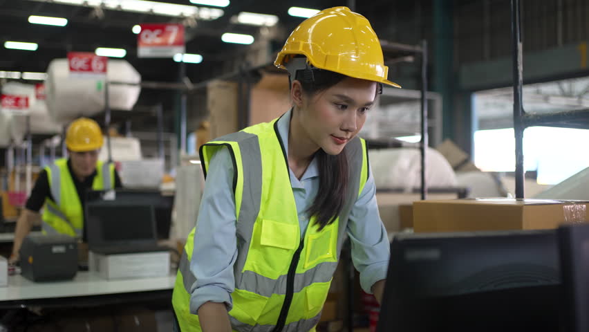 Blue collar workers are working at warehouse. Logistics, transportation.