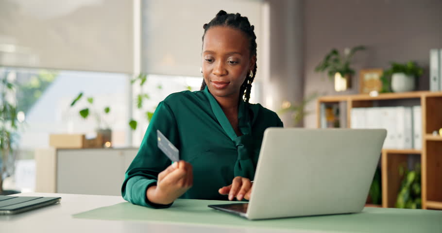 Happy, black woman or laptop with credit card for online shopping, order or payment in office. Female person, shopper or employee with computer or debit for wireless transaction, banking or ecommerce