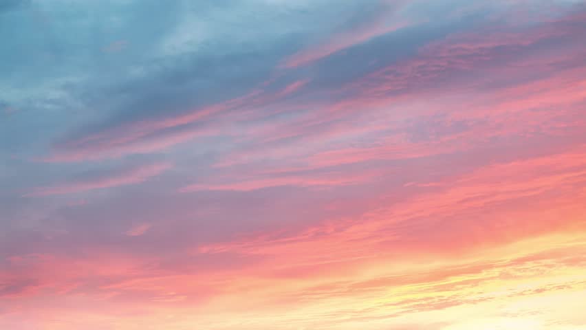 Pastel sunset sky blending blue and pink clouds at dusk. seamless looping 4k video background
