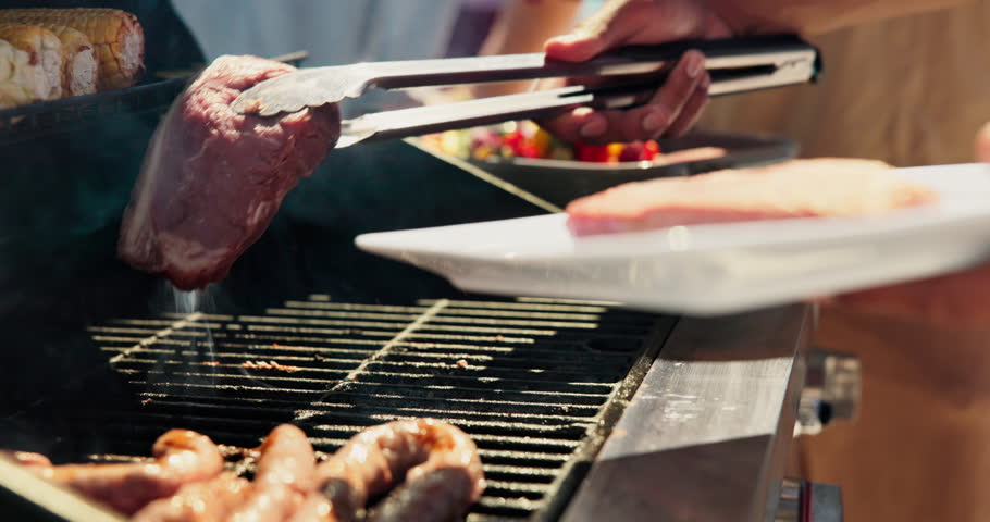 Barbecue, meat and help with hands of friends outdoor for cooking, celebration and lunch. Nutrition, bbq hangout and health with people and cookout event on patio of home for food and vegetables