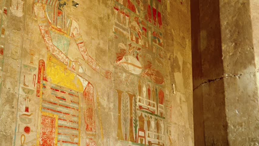 Colored hieroglyphs on the walls of the sacrificial room of the Hatshepsut funeral temple in Luxor. The temple of Ancient Egypt.