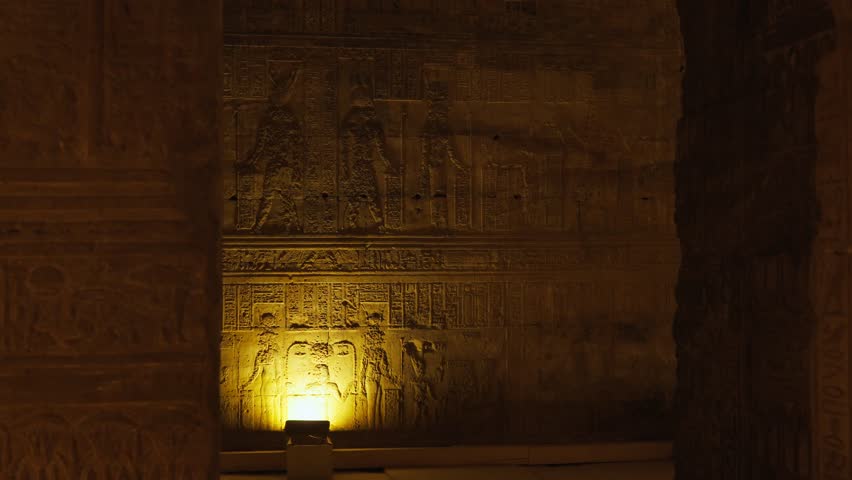 Ancient hieroglyphic carvings on the walls of the temple in Dendera or the temple of Hathor in Egypt. The ancient civilization of the Pharaohs of Egypt.