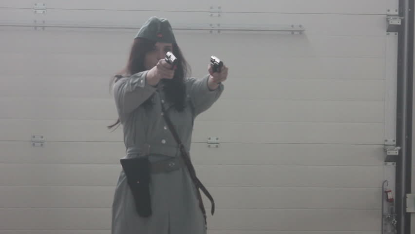 Female officer firing 2 guns