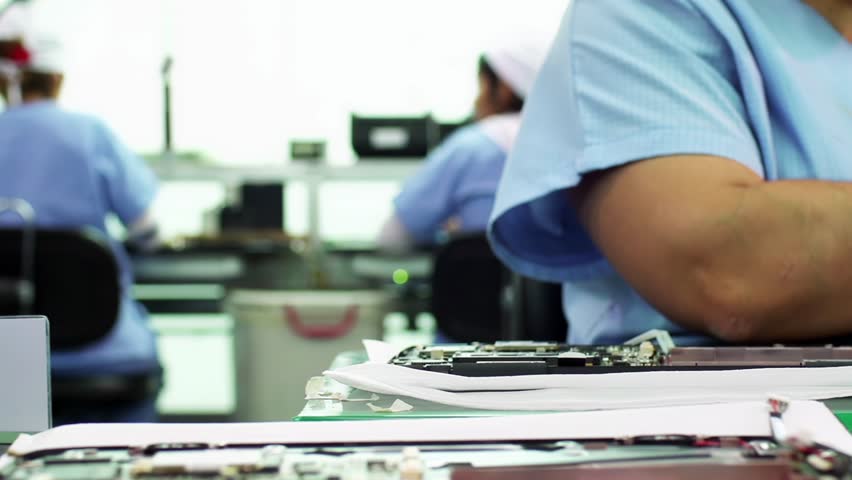 Women on Assembly Line Installing Electronic Components in Laptops - Close Up - 4K