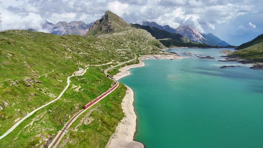 Drone Switzerland 4k. Bernina Pass in Switzerland, aerial view of Lake Bianco, Ospizio Bernina. Swiss Alps landscape, tourism destination in summer.