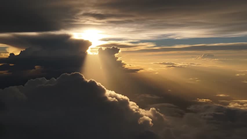 Breathtaking sunset scene with sun rays piercing through dramatic clouds