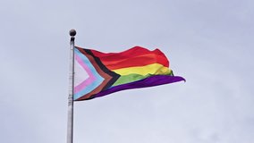 LGBT community. Tolerance and equality. World gay pride. Rainbow gay flag. Pride month. LGBTQ rainbow flag. LGBT rainbow flag waving against sky. Symbol of pride and LGBTQ. Colorful pride flag - Powered by Shutterstock - Get 15% off with code: PIKWIZARD15