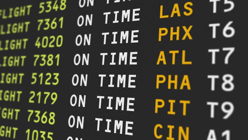 Close-up of an airport information board showing flight delays, highlighting travel disruption, bad weather, and airport operations.