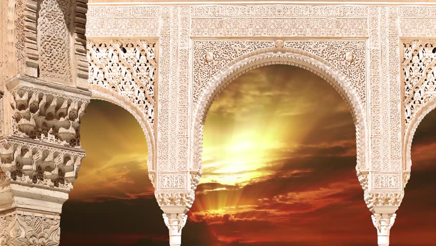 Arches in Islamic (Moorish)  style (against the sunset) in Alhambra, Granada, Spain. 4K, time lapse, with zoom 