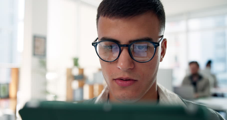 Confused, man and tablet in office with bad news, mistake or 404 error for project. Creative employee, technology and business person with reading, worry and reaction for failure, audit and review