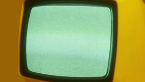 Vintage Yellow Retro TV with Green Screen Static and Analog Signal Interference - Powered by Shutterstock - Get 15% off with code: PIKWIZARD15