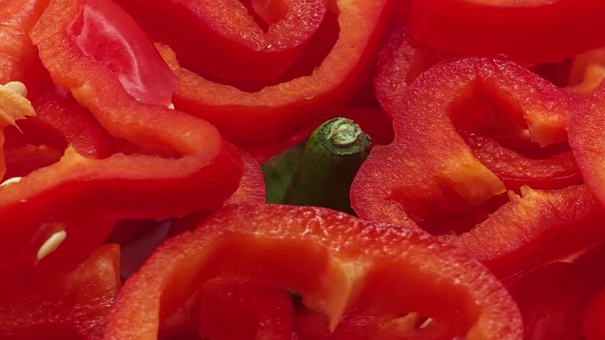 Sliced raw red pepper texture close up. Healthy food background