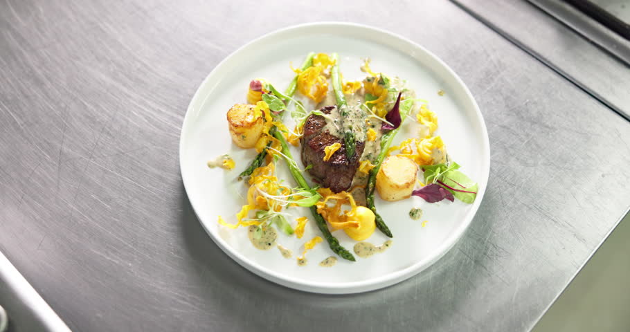 Above, food or fine dining on plate for display, luxury cooking or service in fancy restaurant. Gourmet steak, healthy vegetables or presentation of dinner in culinary school, catering or hospitality