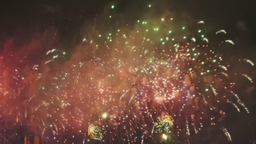 Bright fireworks exploding in night sky. Festive celebration light show. Holiday event display